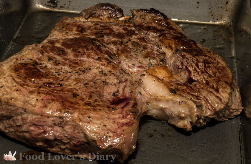 Finished ribeye still in it's oven pan