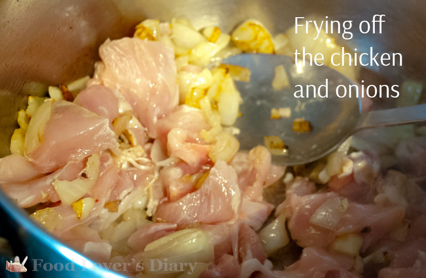 Frying the onions and the chicken