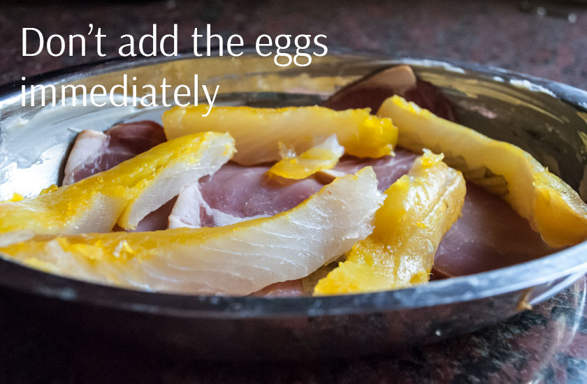 The raw fish and bacon ready to bake