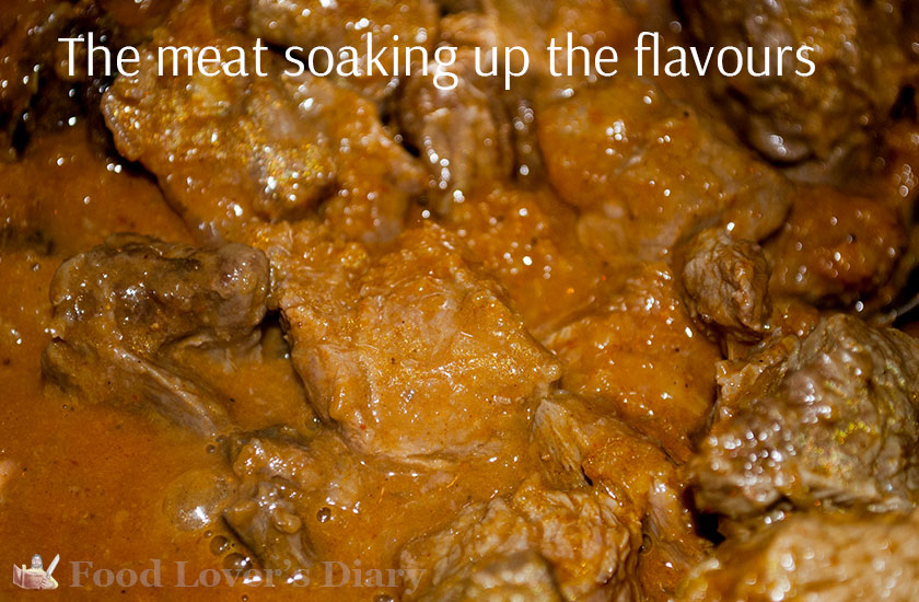 The meat simmering slowly